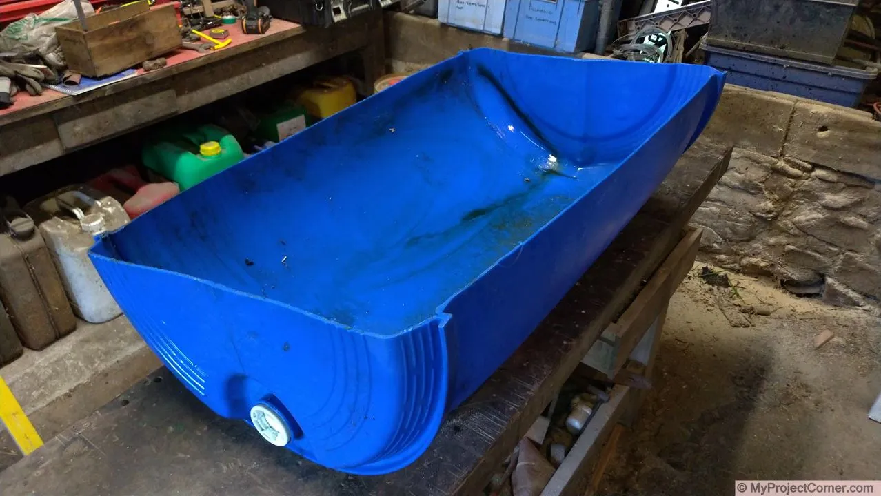 cutting the plastic barrel in half