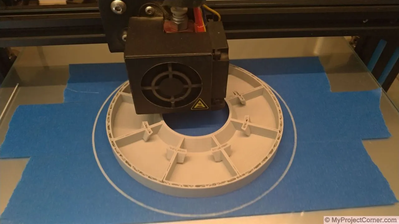 The chicken feeder for PVC pipe being printed on a CR10-s printer