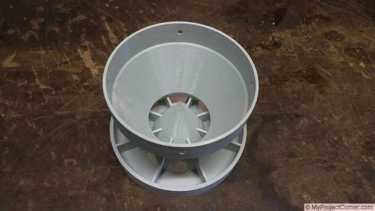The finished 3D print of my chicken feeder design