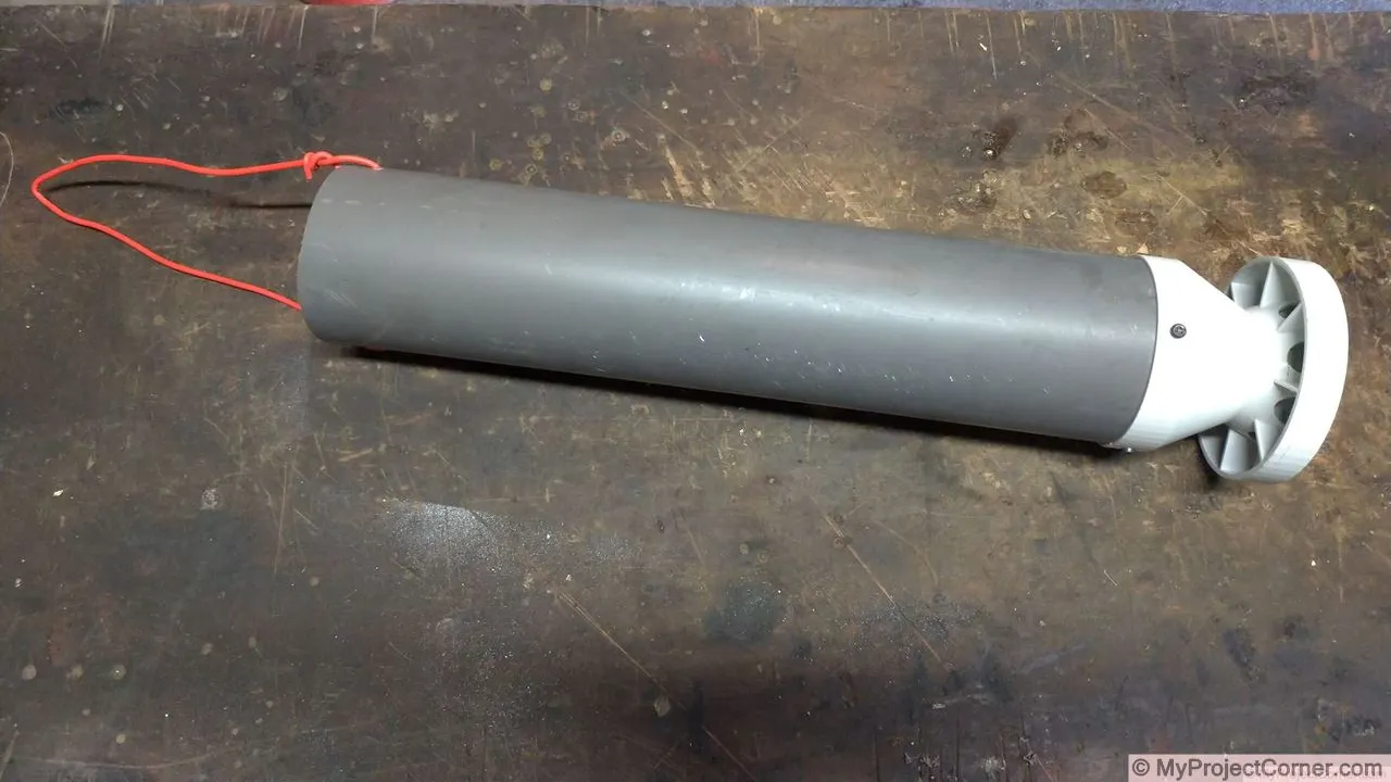 The chicken feeder screwed to the pvc pipe and the hanging wire attached