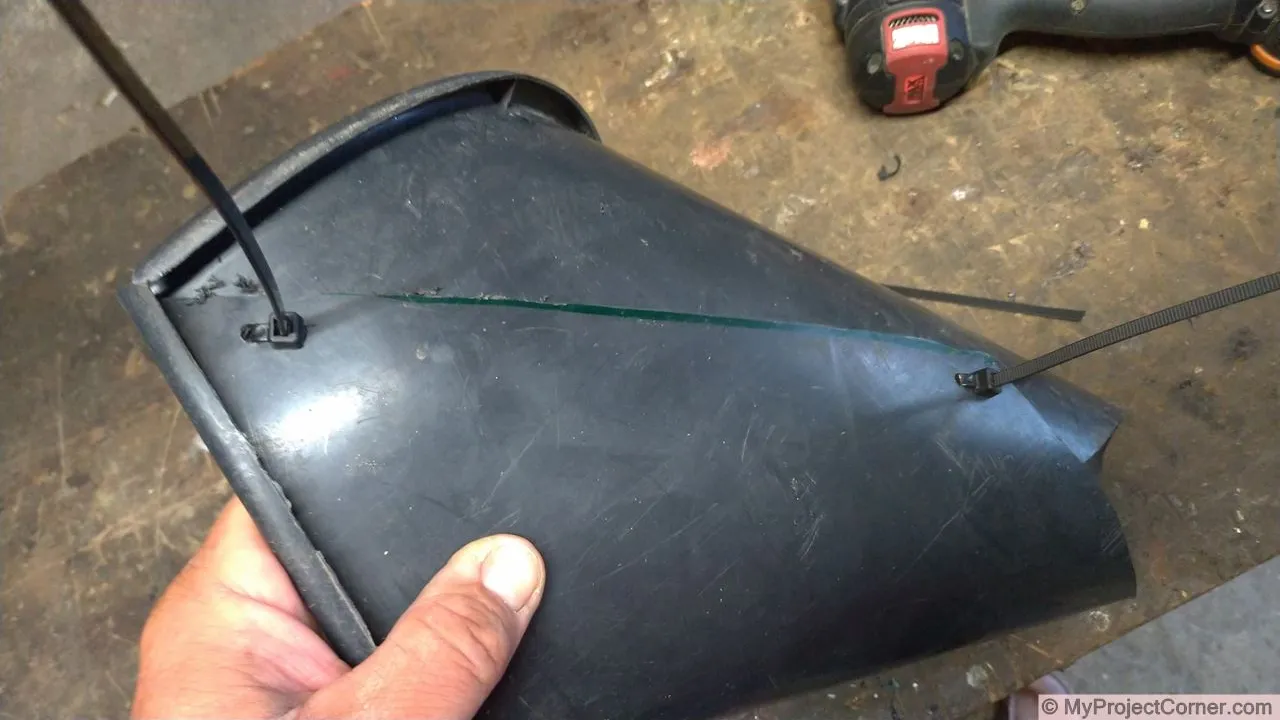 Inserting second cable tie into chicken cone