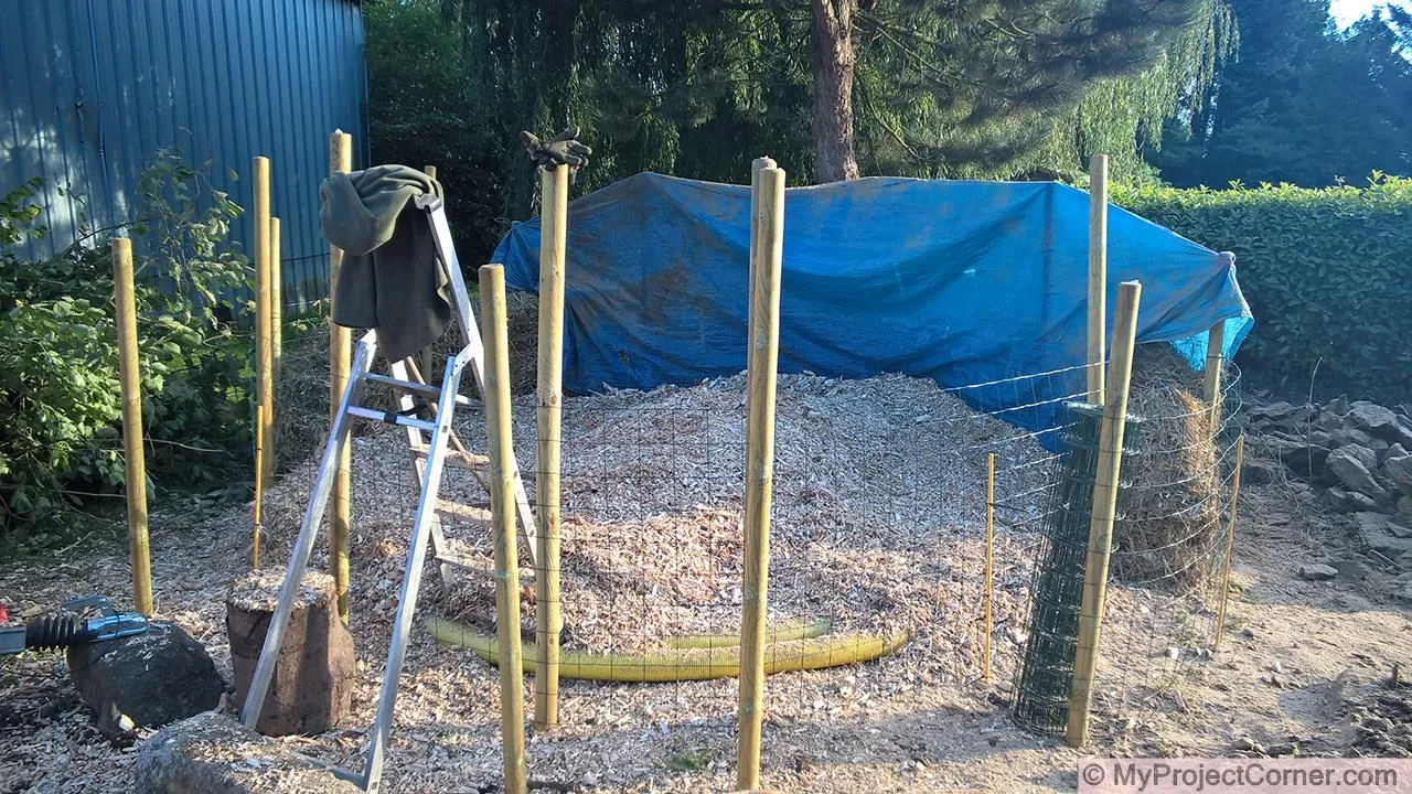base layer of wood chips for compost pile
