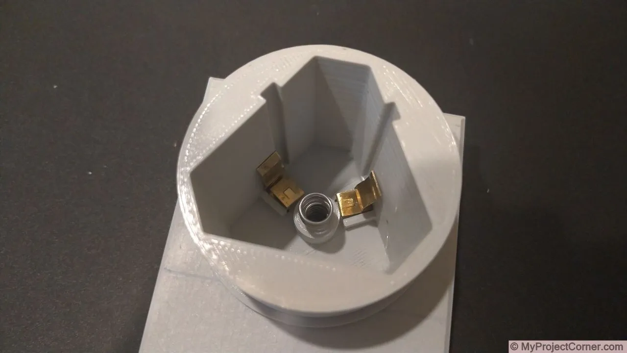 inserting battery terminals and spring for battery adaptor