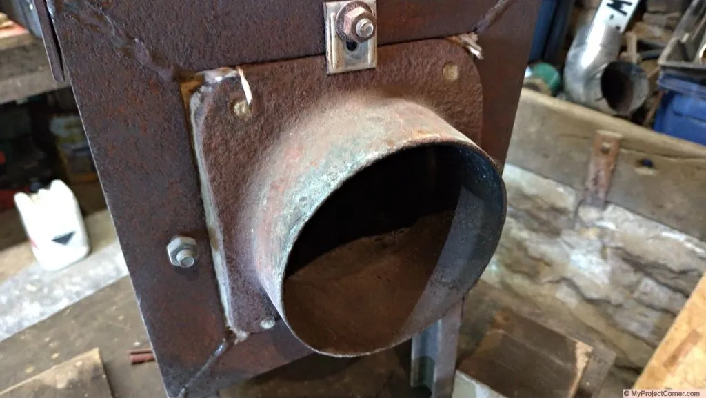 pellet rocket stove fire box flue mounting