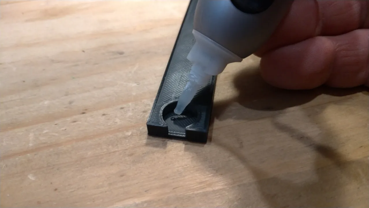 Glue together sections of magnetic poster holder