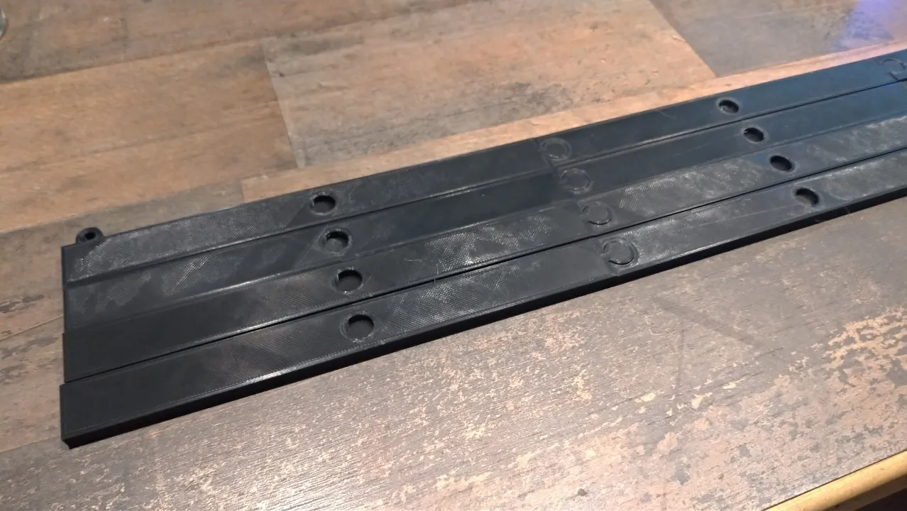 Sections of the poster holder ready to insert magnetics