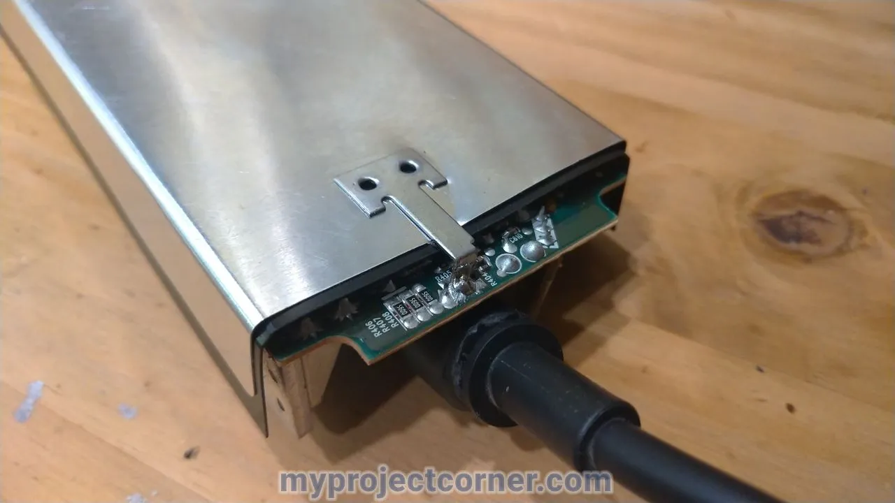 Preparing to un-solder the ends of the metal circuit board cover on xbox one PSU